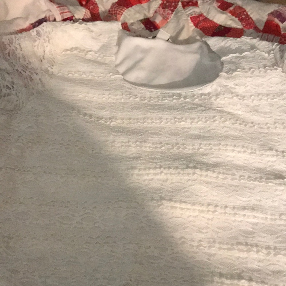 Lace covered silk top.